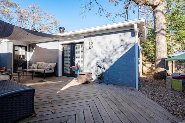 wooden deck featuring outdoor lounge area