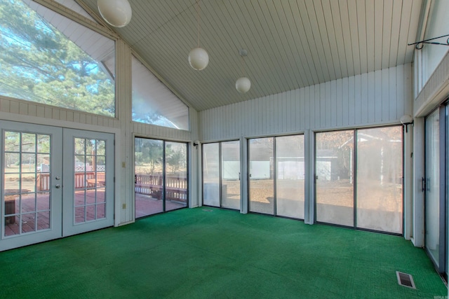 unfurnished sunroom with lofted ceiling and french doors