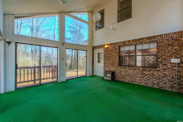 unfurnished sunroom with vaulted ceiling