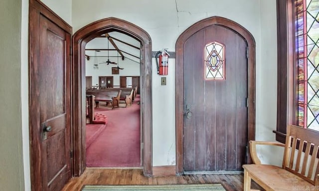 foyer with hardwood / wood-style flooring and ceiling fan