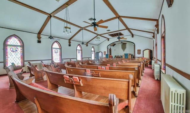 miscellaneous room featuring lofted ceiling with beams and radiator heating unit