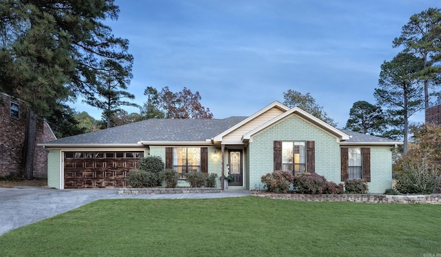 single story home with a garage and a front yard