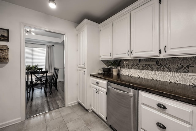 kitchen featuring decorative backsplash, dishwasher, white cabinets, and light hardwood / wood-style floors