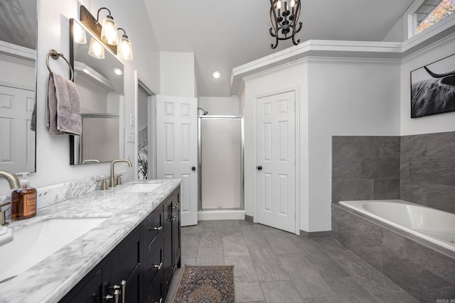 bathroom featuring vanity, lofted ceiling, and plus walk in shower