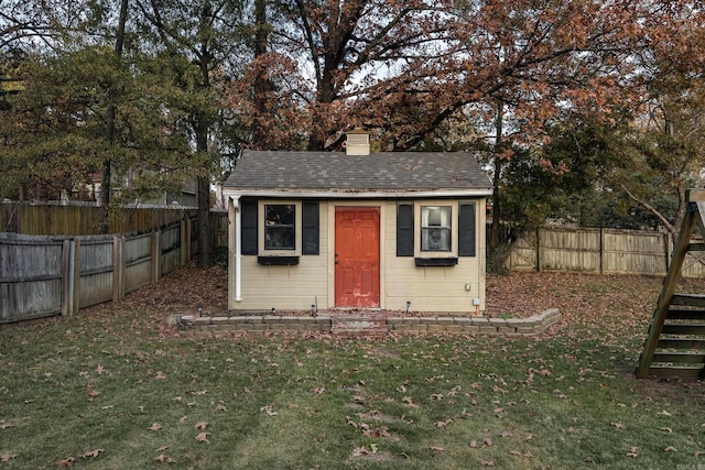 view of outbuilding featuring a lawn