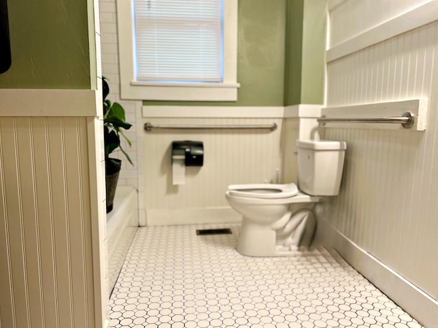 bathroom with tile patterned floors and toilet