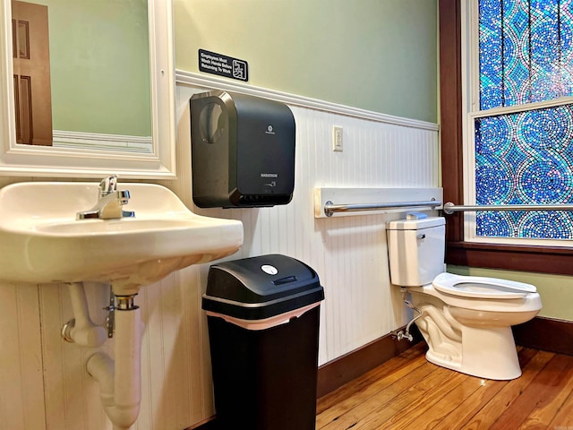 bathroom featuring hardwood / wood-style floors and toilet