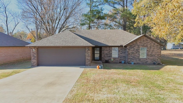 ranch-style home featuring a garage and a front yard