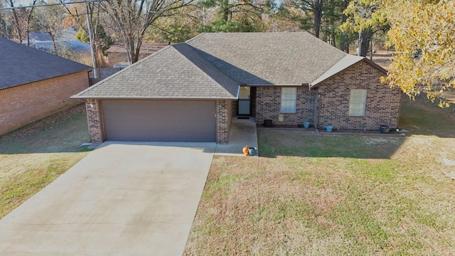 ranch-style house featuring a garage and a front yard