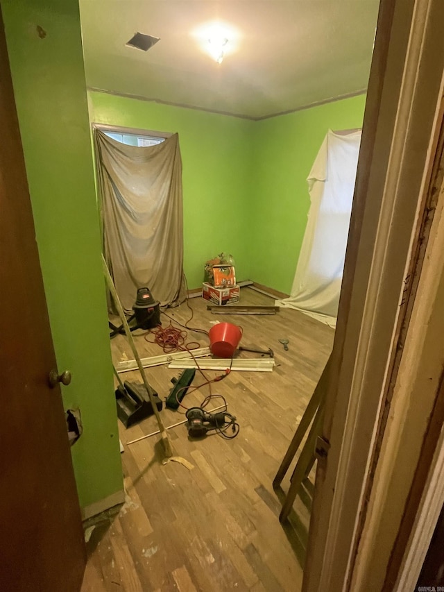 bedroom with hardwood / wood-style floors