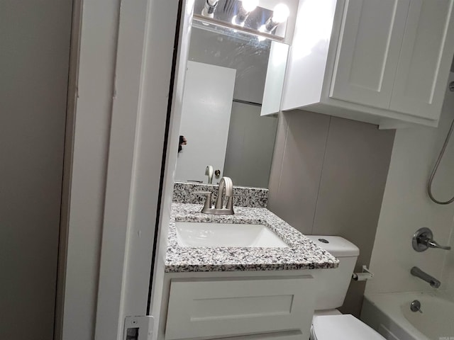 full bathroom with toilet, vanity, and tub / shower combination