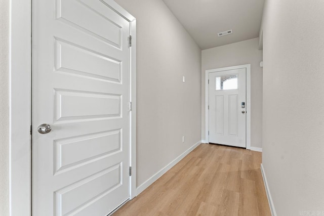 doorway with light hardwood / wood-style flooring