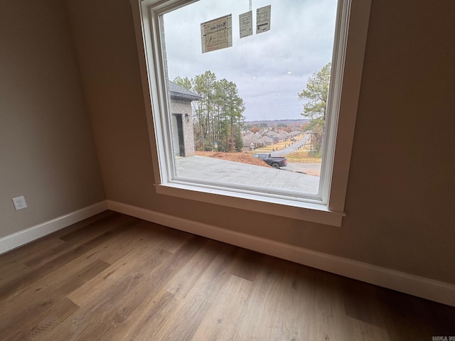 unfurnished room featuring wood-type flooring