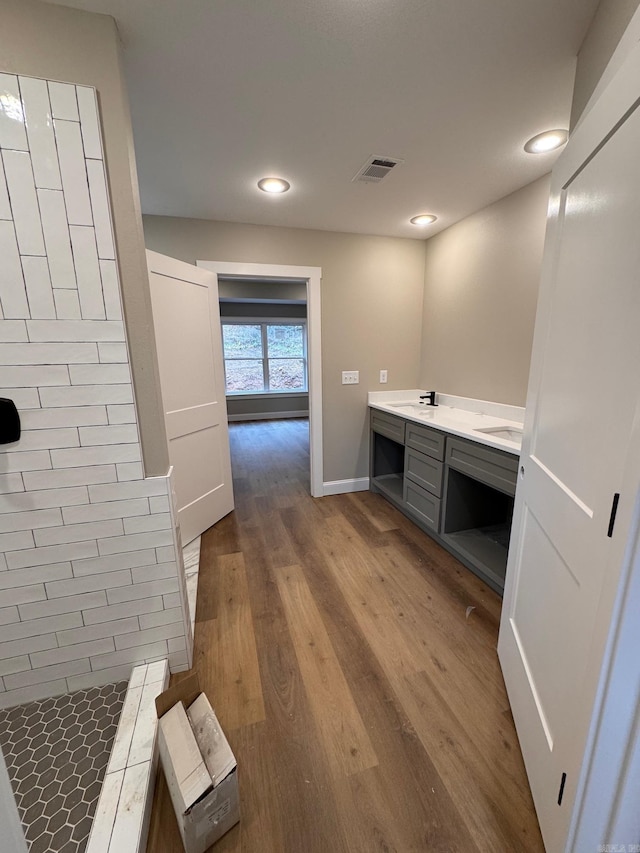 bathroom featuring vanity and hardwood / wood-style floors