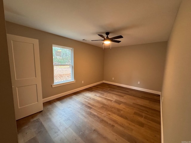 unfurnished room with wood-type flooring and ceiling fan