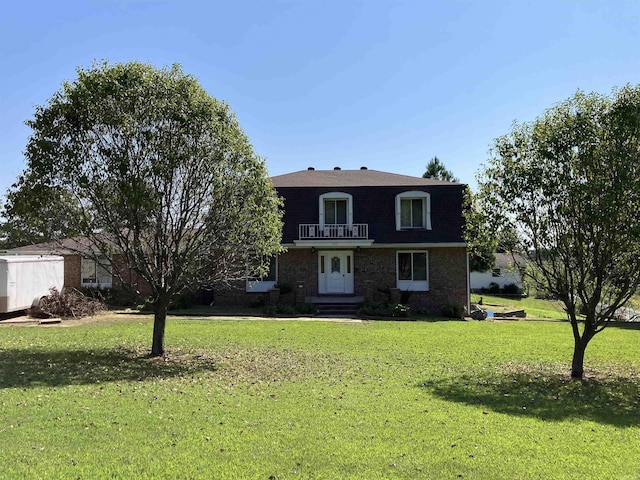 view of front of property with a front lawn