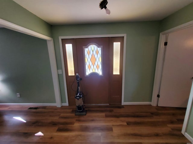 entryway with dark hardwood / wood-style flooring