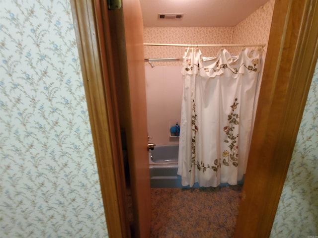 bathroom featuring shower / bath combination with curtain