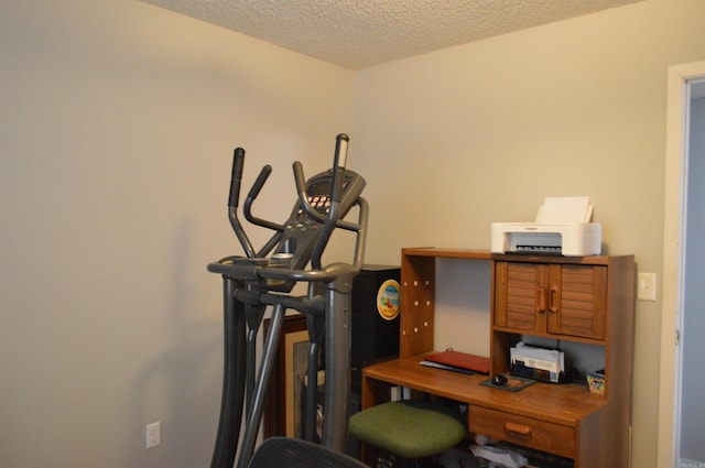 office space with a textured ceiling