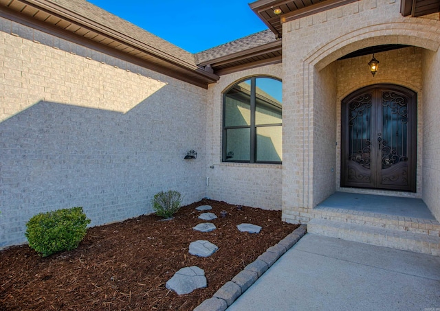 entrance to property featuring french doors