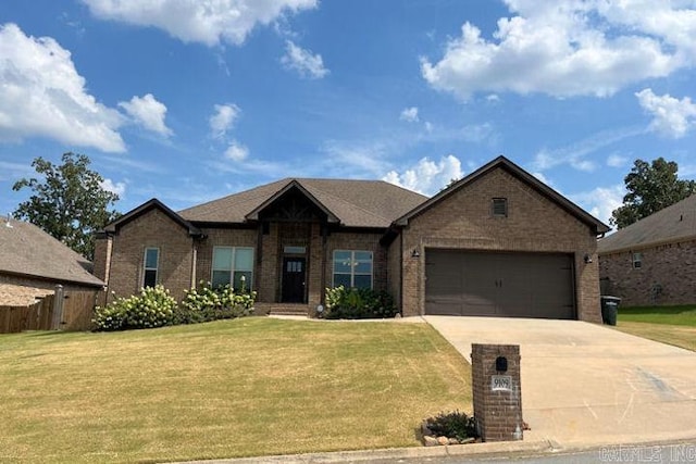 view of front of house featuring a front yard and a garage