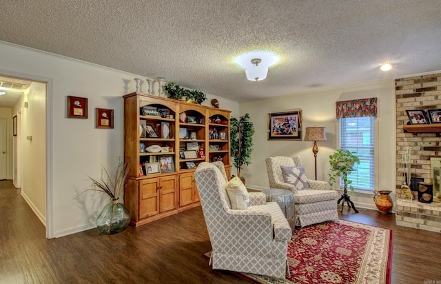 living room featuring a fireplace, dark wood-type flooring, and a textured ceiling