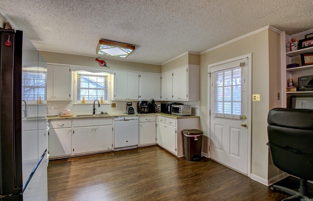 kitchen featuring white cabinets, crown molding, sink, dishwasher, and dark hardwood / wood-style floors