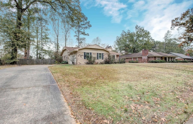 ranch-style house with a front yard