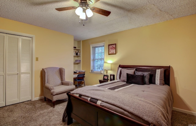 carpeted bedroom featuring a textured ceiling, a closet, and ceiling fan