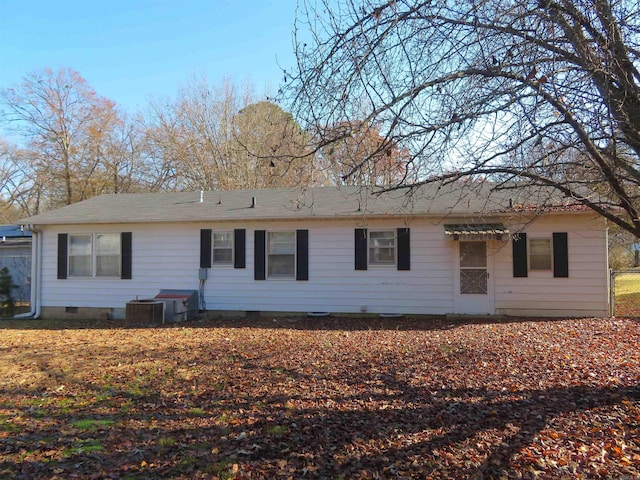 ranch-style house with central air condition unit