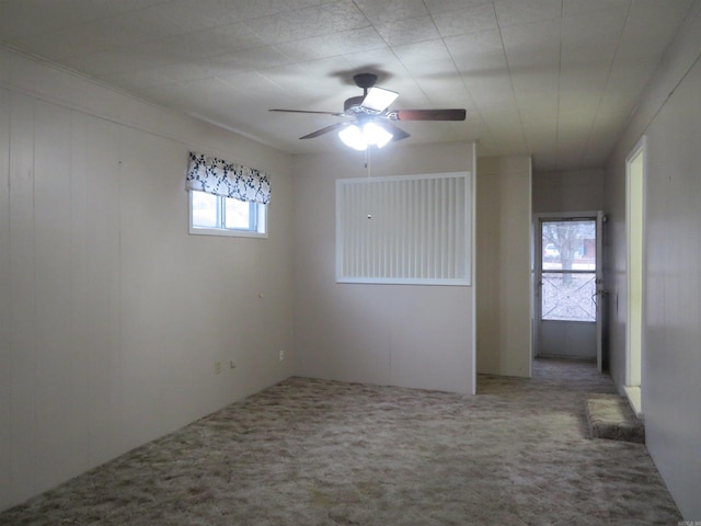 carpeted empty room with ceiling fan