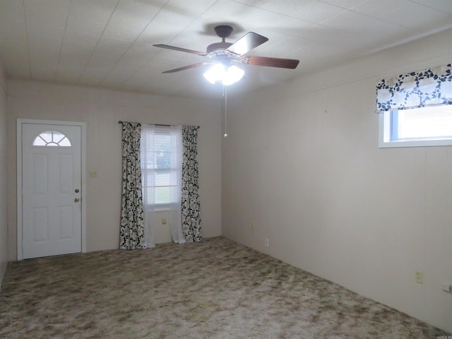 foyer with carpet flooring and ceiling fan