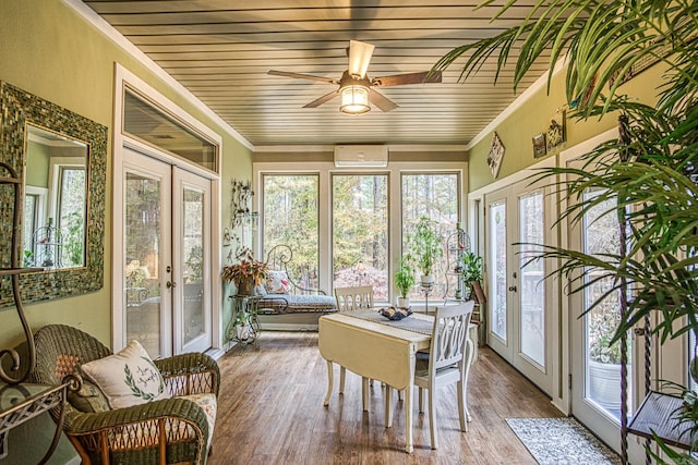 sunroom / solarium with ceiling fan, wood ceiling, a wall mounted AC, and french doors