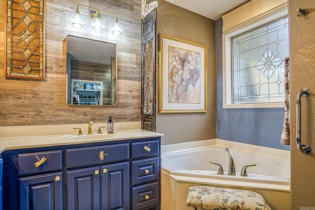 bathroom featuring a tub, wood walls, and vanity