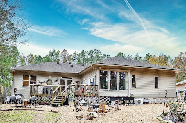 rear view of house featuring a deck