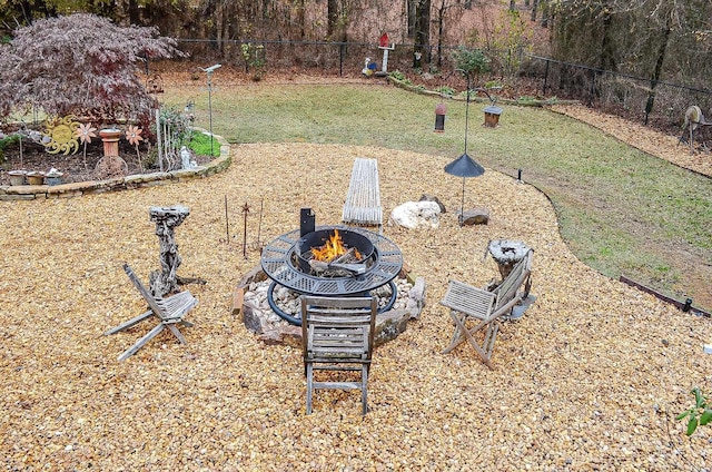 view of yard with an outdoor fire pit