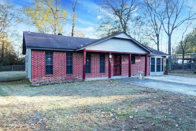 ranch-style house with a front lawn