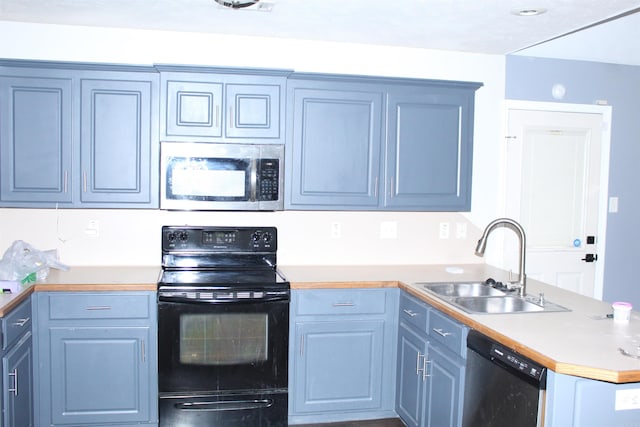 kitchen featuring appliances with stainless steel finishes, blue cabinets, and sink