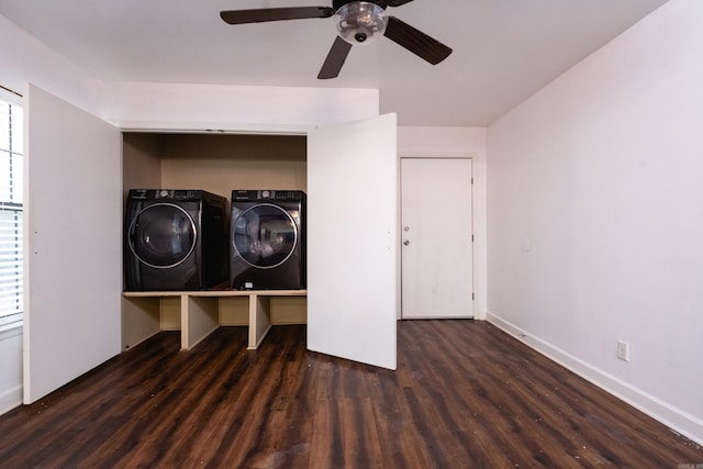 laundry area featuring ceiling fan, washer and clothes dryer, and dark hardwood / wood-style floors