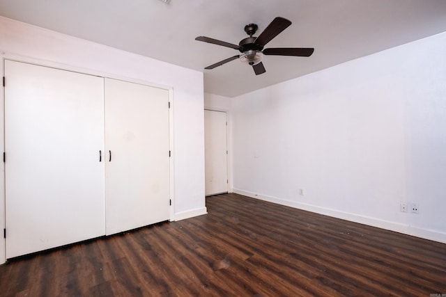 unfurnished bedroom featuring dark hardwood / wood-style floors and ceiling fan