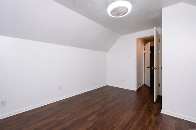 additional living space with lofted ceiling and dark hardwood / wood-style floors