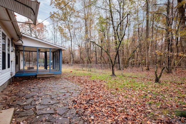 view of yard featuring a sunroom