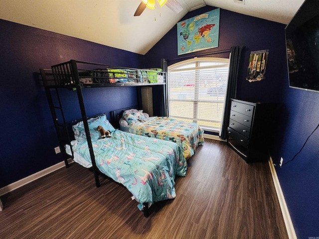 bedroom featuring ceiling fan, dark hardwood / wood-style flooring, and lofted ceiling