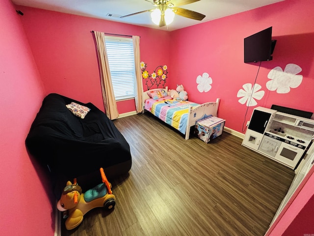 bedroom featuring ceiling fan and hardwood / wood-style flooring