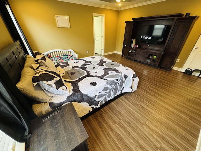 bedroom featuring wood-type flooring and ornamental molding