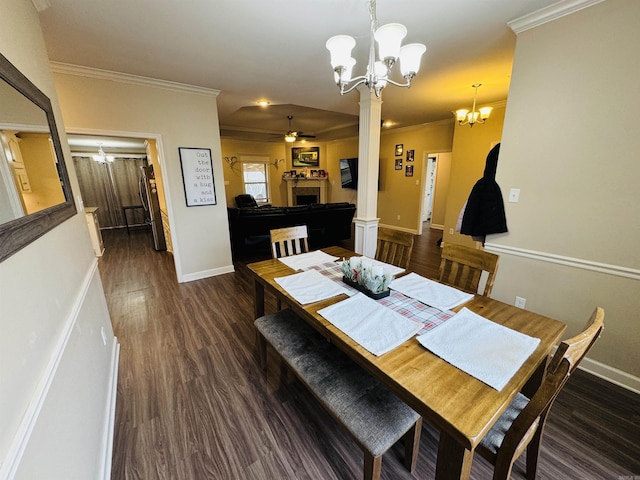 dining area with ceiling fan with notable chandelier, dark hardwood / wood-style flooring, and crown molding