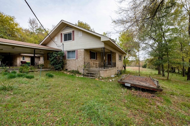 back of house with a lawn