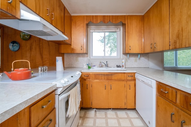 kitchen with tasteful backsplash, sink, and white appliances