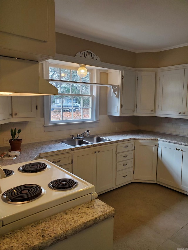 kitchen with tasteful backsplash, sink, and white cabinets