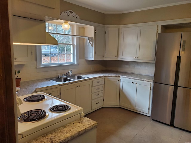 kitchen with backsplash, stainless steel fridge, sink, and white electric range oven